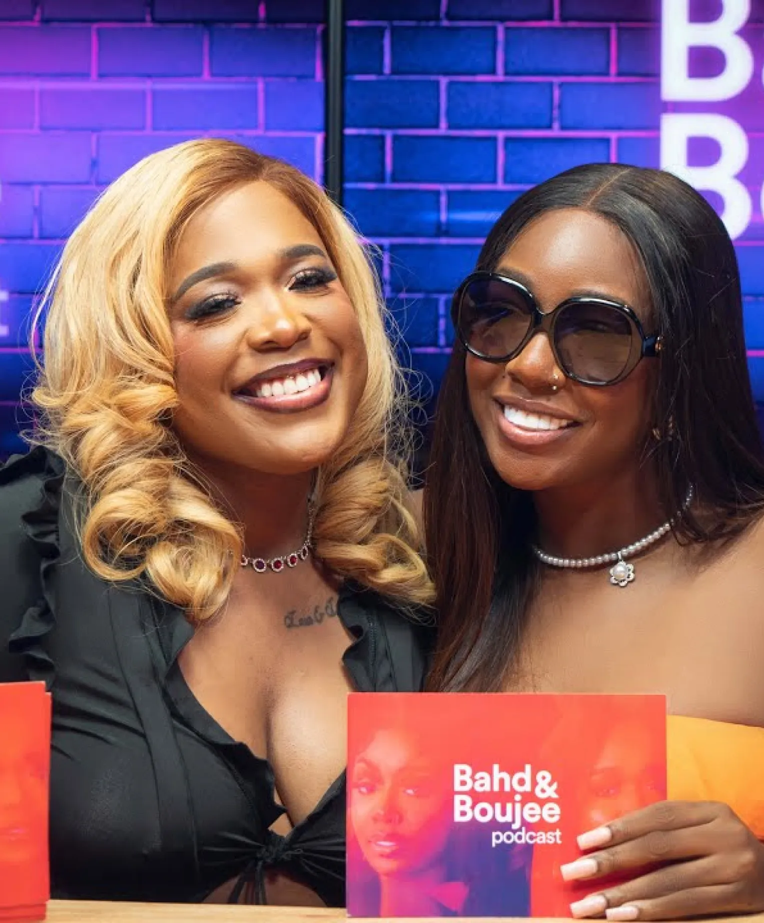 Tolani Baj and Moet Abebe smiling in a photo for Bad & Boujee Podcast on Glitch Africa Studio